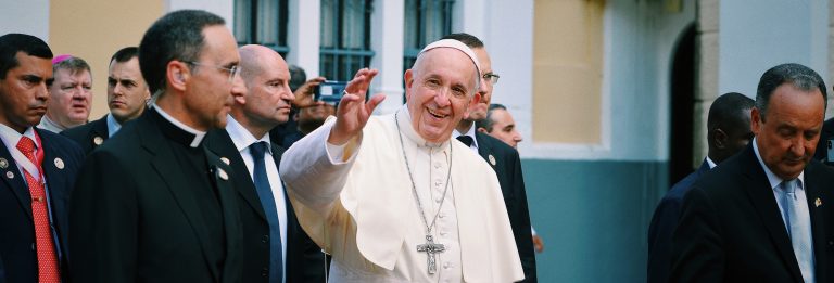 Pope Francis waving to group of people