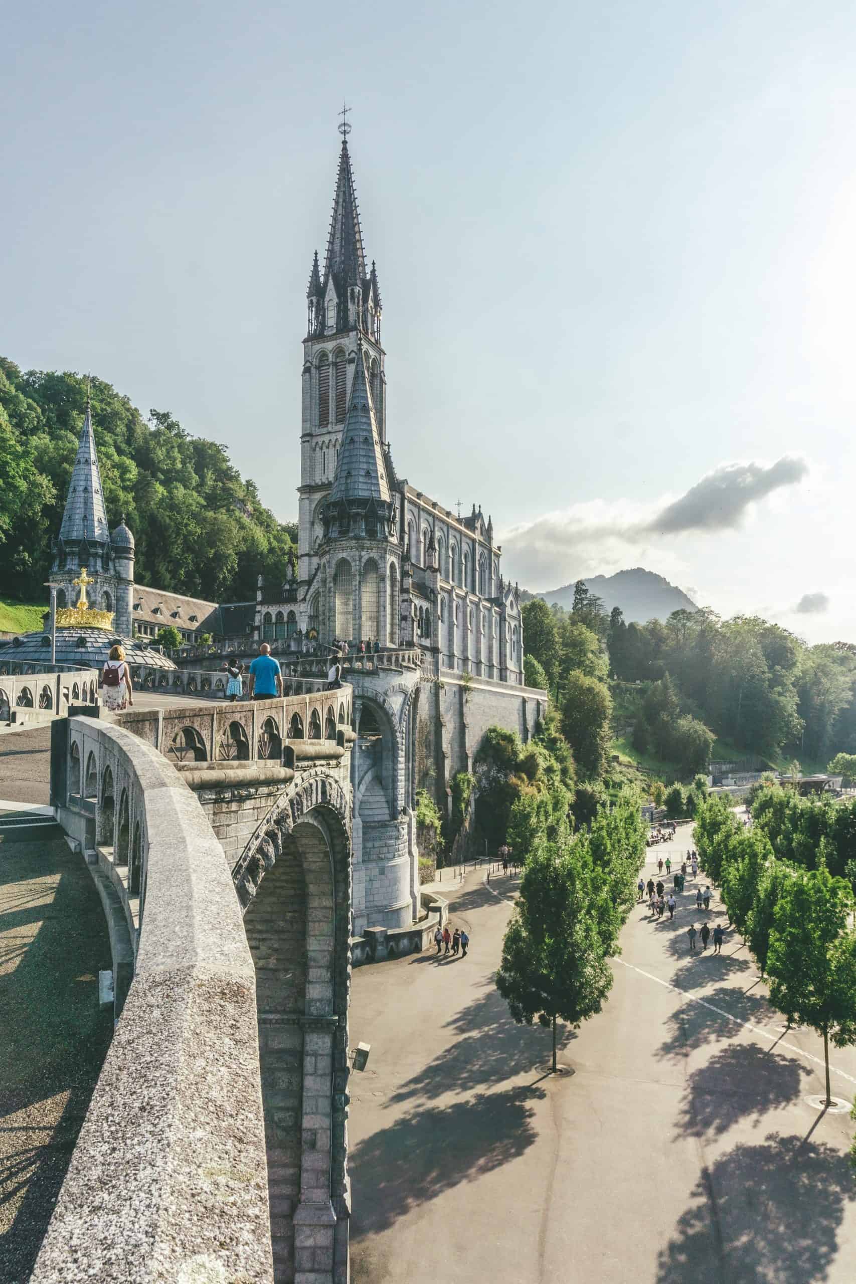 Walking up to the Sanctuary of Our Lady of Lourdes, one of the top France pilgrimage sites.