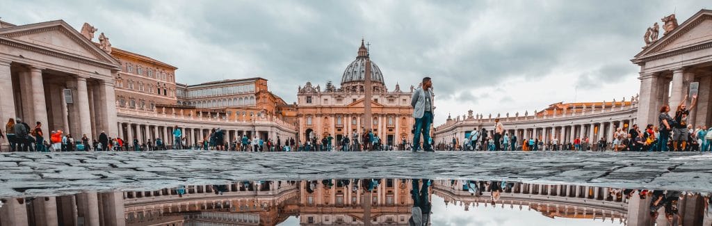 Pilgrims stand outside St. Peter's Basilica, Vatican City